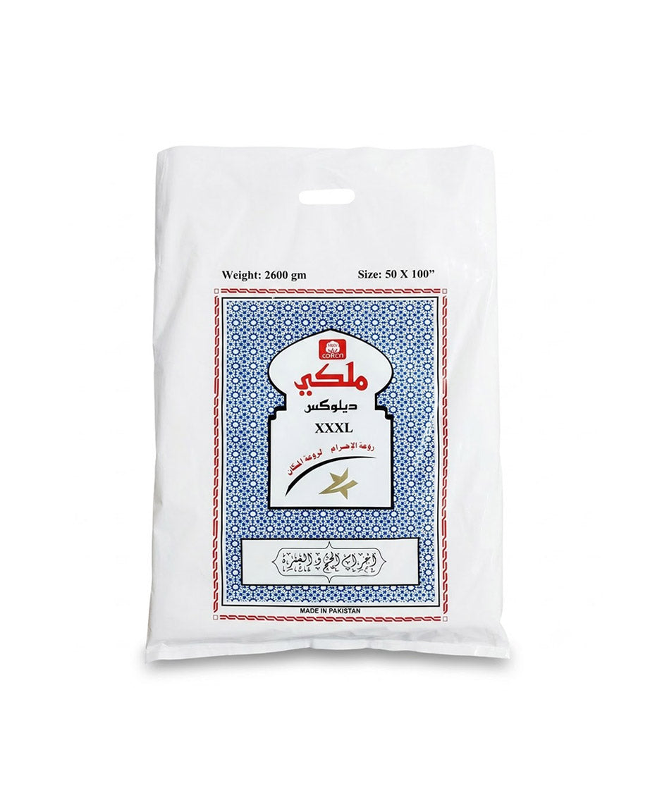 A white plastic bag of cotton bed sheets with a blue, white, and red printed label on the front, set against a plain white background.